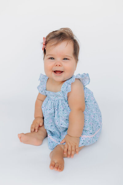 Personality Portraits Sitting Up Session with nine month old baby girl with Asheville, NC Family Photographer Rachel Marie Photography