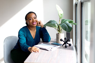 Florida Attorney Nequosha Anderson sitting at a desk in front of a window