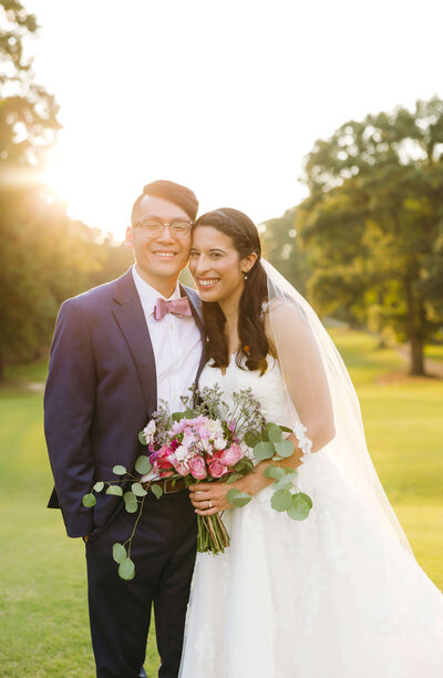 charlottesville wedding photographer captures bride and groom laughing under the brides veil at a northern virginia wedding venue