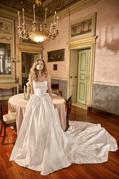 black and white image bride wearing  long sleeve lace wedding dress