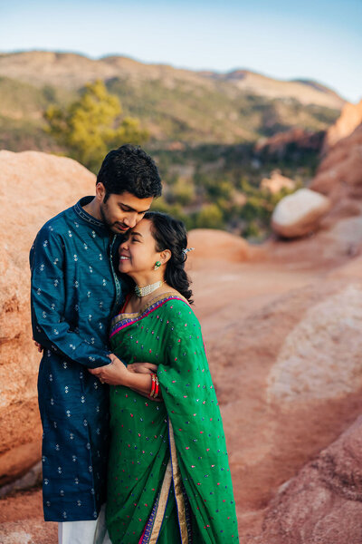 Boulder Wedding Photographer captures couple hugging during outdoor engagement photos