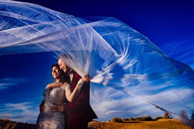 Wedding Photo of a couple holding a veil in el paso texas