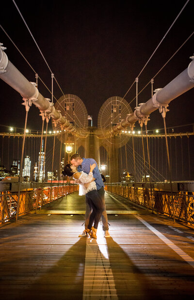 Couple kissing on Brooklyn Bridge