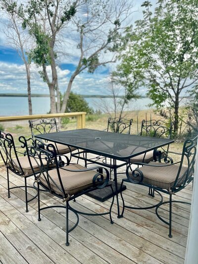 patio table on deck overlooking lake