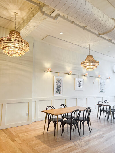 Reception space at Common House Richmond with woven chandeliers and minimalist decor for modern Richmond VA weddings.