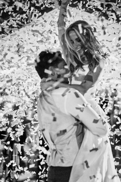 bride and groom dancing with confetti