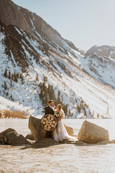 A couple eloping on a frozen lake in Mammoth California