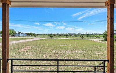 View from the porch of this three-bedroom, two-bathroom rental farmhouse near Lake Waco, golf courses, and 15 minutes to downtown Waco & Baylor.
