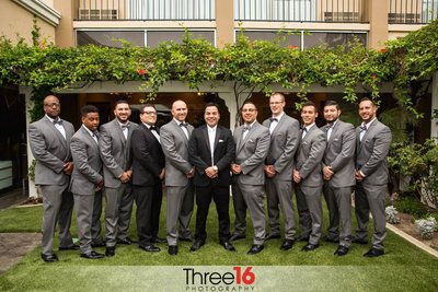 Groom poses with his Groomsmen at the Hotel Fullerton