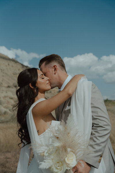 Wedding portrait of a couple at Lester Beach, Manitoba captured by Longpine Photography