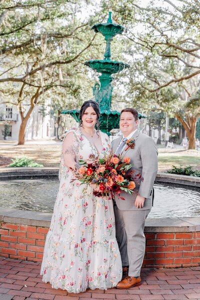 A stunning portrait of Alexis + Karlie after their elopement ceremony at Lafayette Square in Savannah, captured as part of our Savannah Elopement Package.