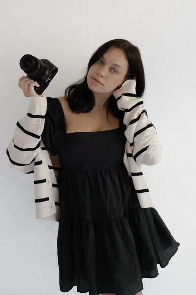Holding Camera and laptop