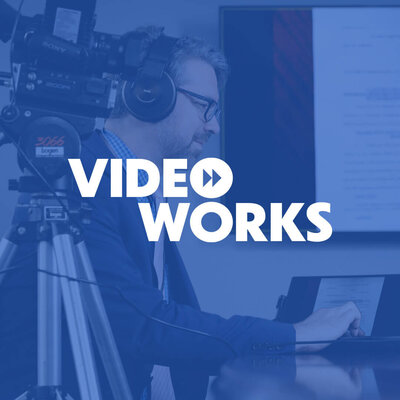 Videoworks Branding Identity Design Work - White Logo Design On A Blue Background With A Photo Of A Man And A Camera