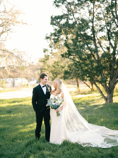 Bride and Groom golden hour blue bouquet at Posey Meadows wedding venue in San Marcos Texas
