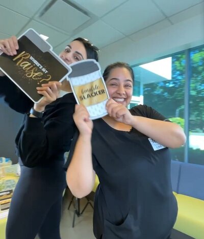 Friends posing with coffee props at an event in Vancouver