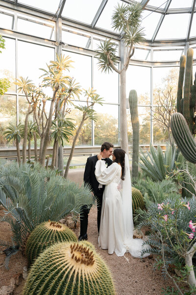 Austin wedding photographer captures bride and groom portrait in greenhouse in austin, tx