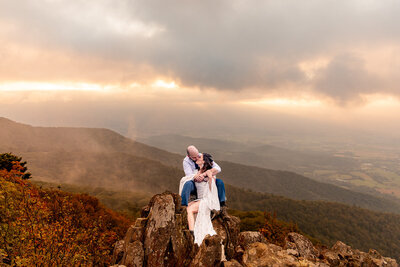 couple sitting on mountain