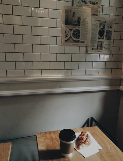 Coffee and bread in grey corner