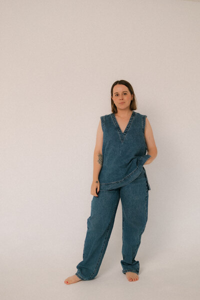 Liv Rollings posing in a studio in a denim outfit