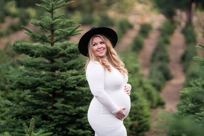 Outdoor Seattle maternity photo  of women in dress and black hat