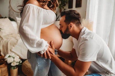 Expectant parents pose for Maternity Photoshoot in Asheville Photo Studio.