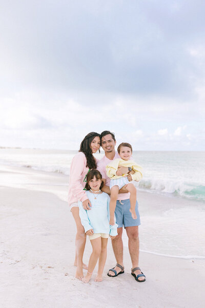 Cassie Loree and her family posing on the beach