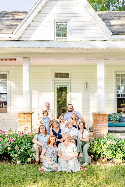 Extended family in shades of blue and green on the front porch at home in Sardinia, Ohio.