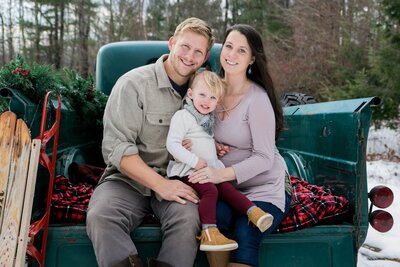 Photo of Family Sitting on Bed of Pickup Truck | Maternity Session