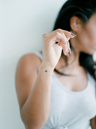 Young woman with her arm gently raised