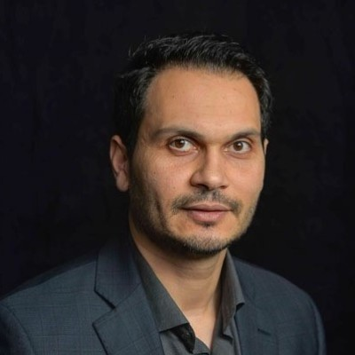 black male in suite and bow tie headshot