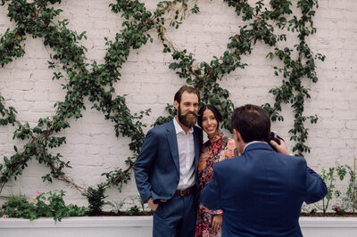 Rooftop ceremony setup at Quirk Hotel with floral pillars and Richmond skyline, captured before Chris and Dave’s wedding.