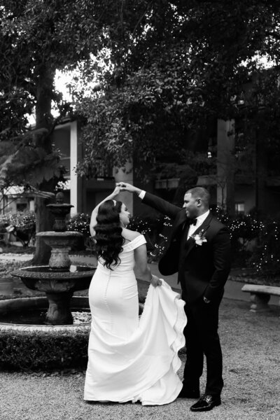 groom spinning bride