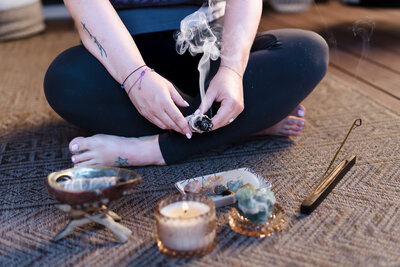 woman hands posing with an incense