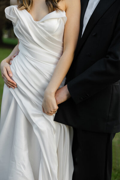 modern wedding couple walkimg the grounds of Stones of the Yarra Valley