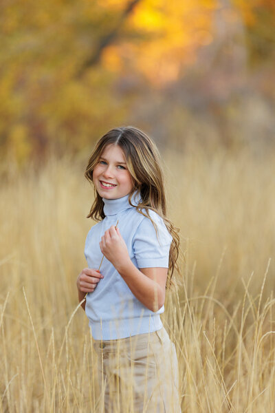 Little girl in a field near the Boise greenbelt.