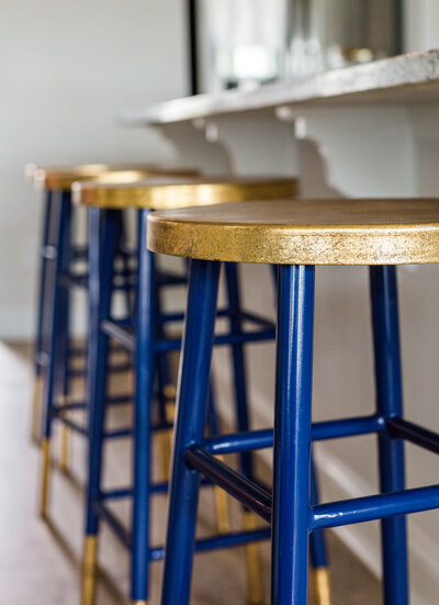 Blue bar stool with golden top