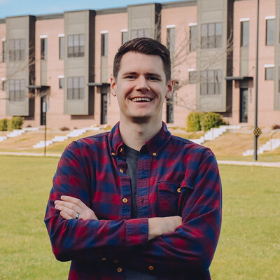 A portrait of a man smiling at the camera