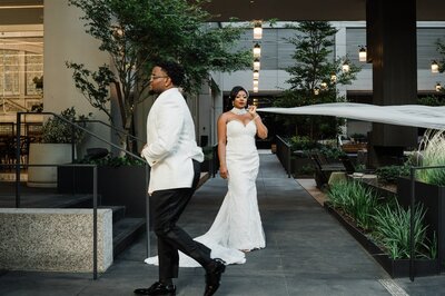 Black couple celebrating their elegant Harlem Renaissance-inspired wedding at the Lotte Hotel Seattle, featuring vintage black-tie style and modern luxury photography by Captured by Candace.