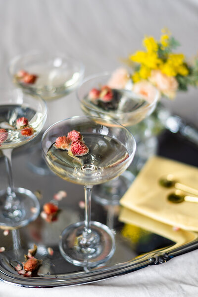 cocktail glasses with floral decorations