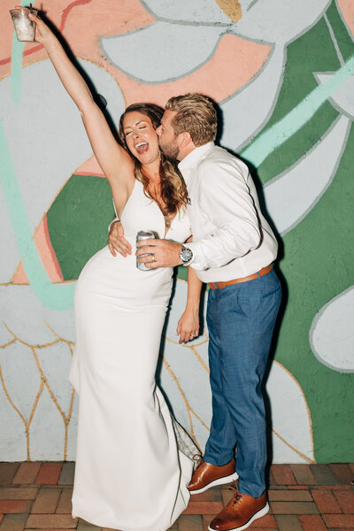 Virginia Wedding Photographer, bride and groom leaning against a light post