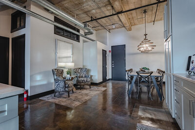 Dining room and seating in a luxurious modern vacation rental condo in historic Behrens building in downtown Waco, TX