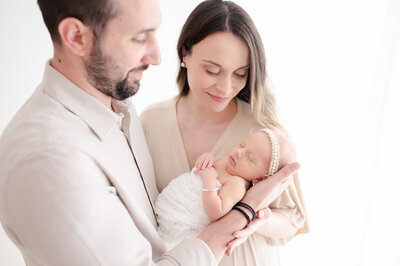 Newborn baby girl with a flower headband