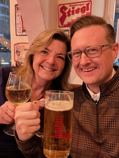 Photo of Kelly and Jason Smiling with Drinks