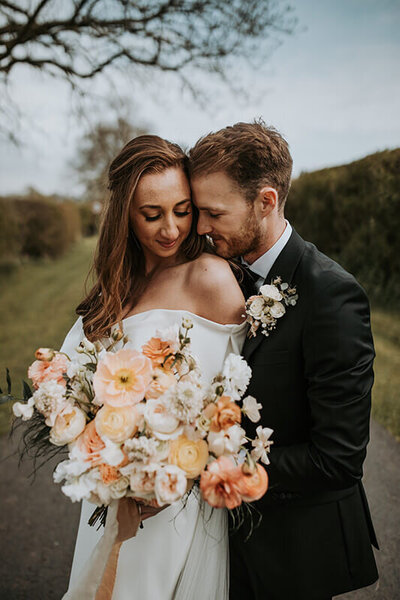 Romantic moment between bride and groom at Eden Barn
