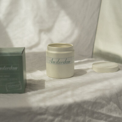 Amsterdam travel themed candle with wood wick and natural soy in a reusable container