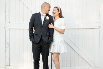 Couple smiling at each other on wedding day