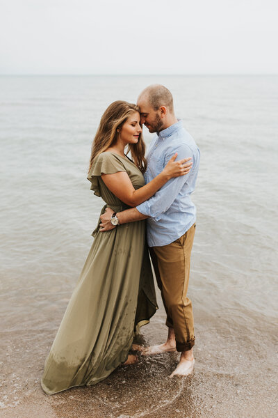 couple embracing at lake shore