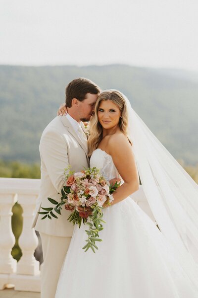 bride putting in earrings