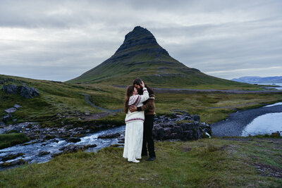 KIRKJUFELL Iceland elopement, couple standing in front of the mountain