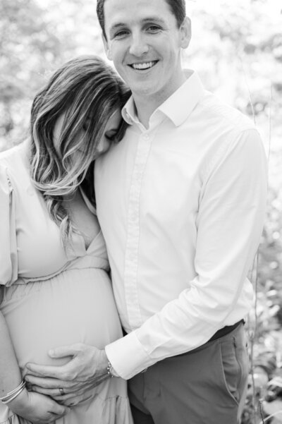 Engaged couple hugs during their engagement session at Anchorage Trail in Louisville, Ky